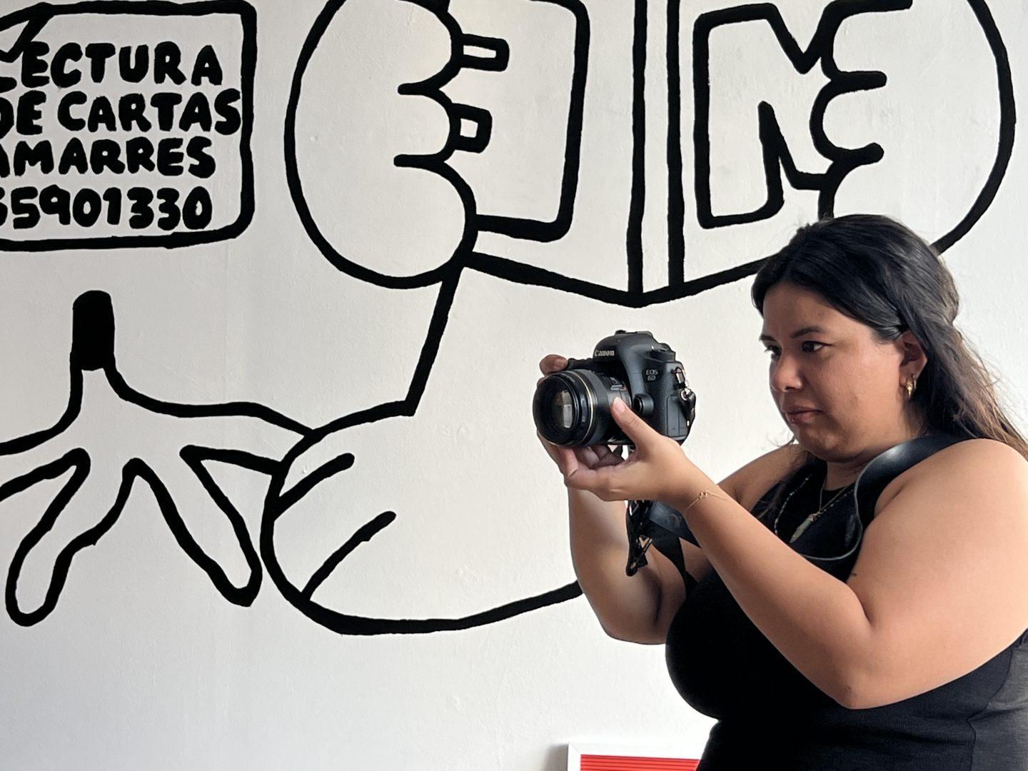 Meli Flores uses photography as a way to connect with her culture. (Viviana Hinojos/The Collegian)