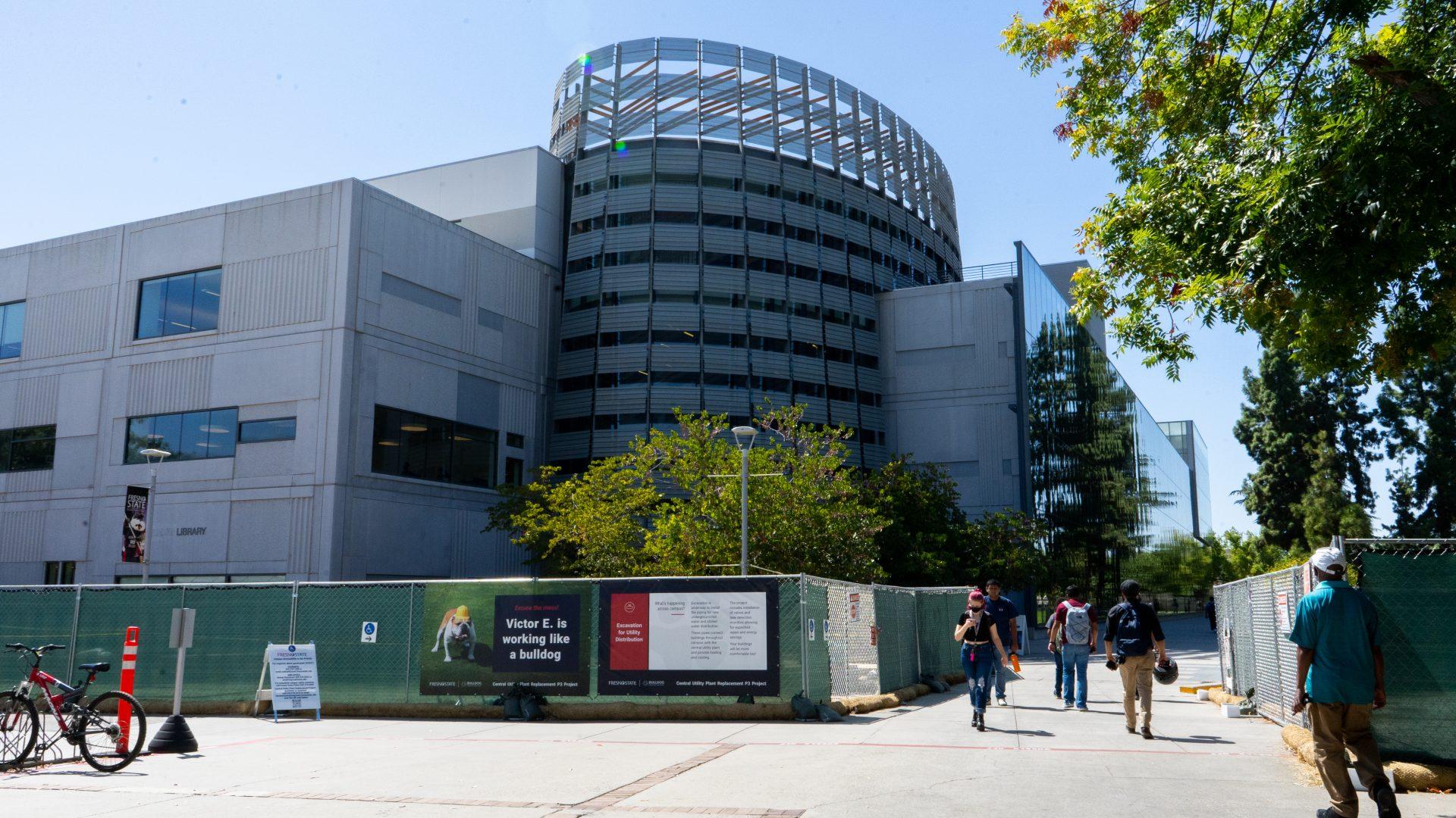 Photo of the Fresno State Library on Sep. 1. The first phase of the Central Utility Plant Replacement (CUPR) Project began in May, installing safety fencing in two large areas of campus. (Eric Martinez/The Collegian)