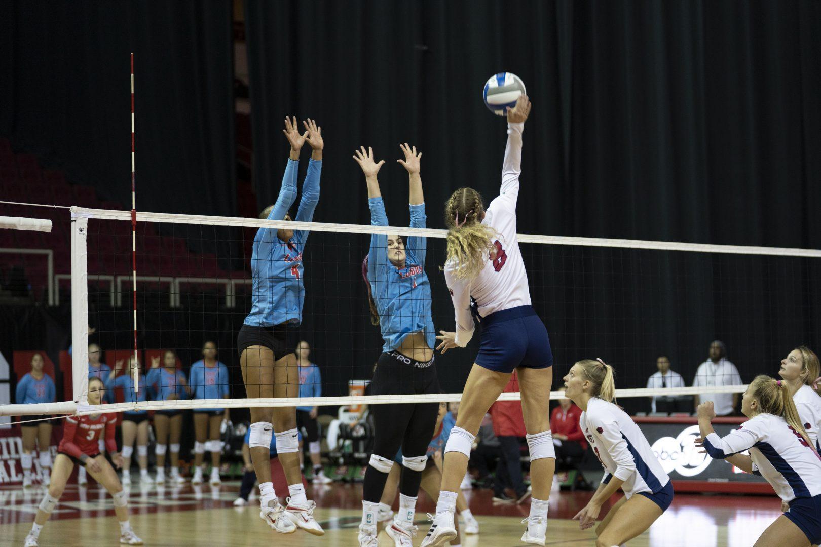 Ella Run (8) spikes the ball in the game against New Mexico on Oct. 22, 2022. (Blake Wolf/ The Collegian) 
