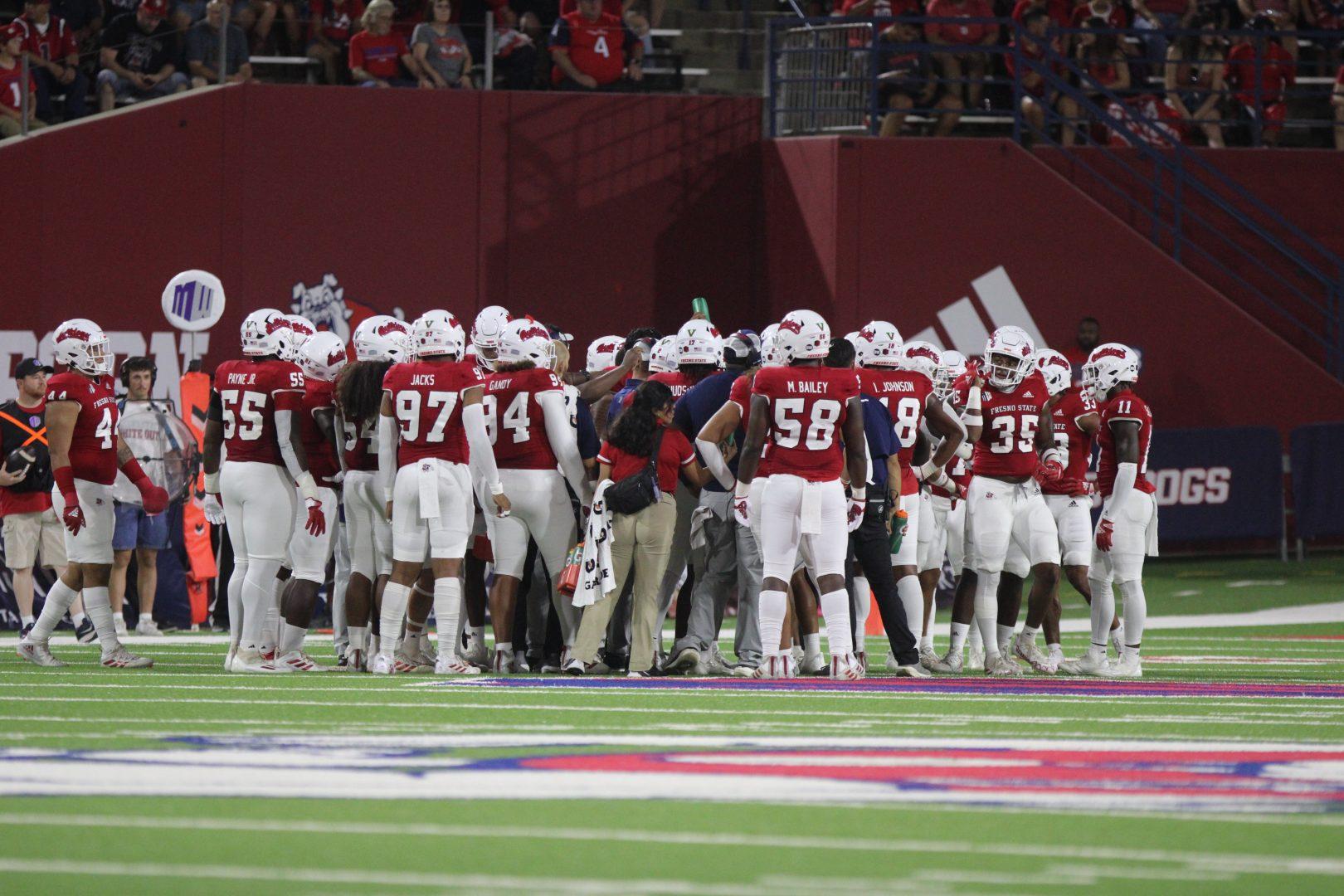 Fresno State football in a huddle during a timeout against Oregon State on Sept. 9, 2022, at Valley Childrens Stadium. (Estela Anahi Jaramillo/ The Collegian) 