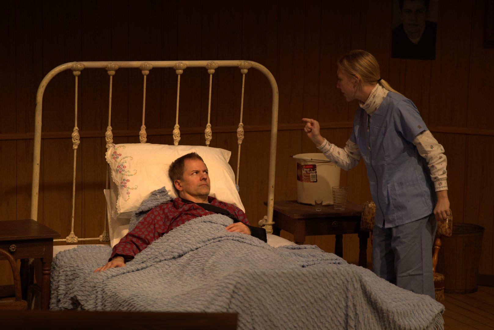 Stephen Cloud (left) plays Paul Sheldon, an author who finds himself at the mercy of his No. 1 fan, Annie Wilkes, played by Bethany Rand (right). (Blake Wolf/The Collegian)