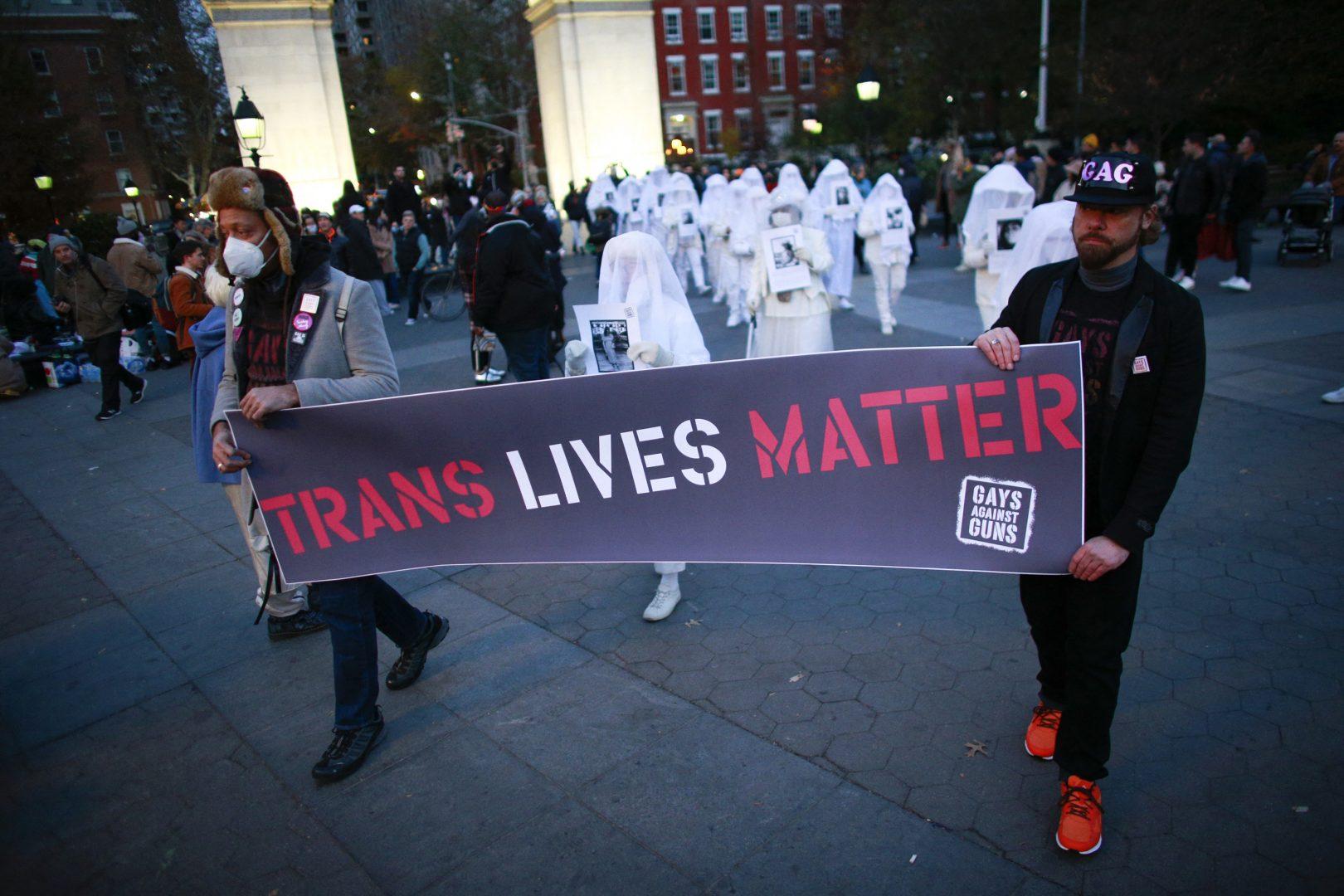 People hold a Trans Lives Matter banner as they march, honoring transgender victims, killed for who they are, during the Transgender Day of Remembrance in Washington Square Park on Nov. 20, 2021, in New York. (Kena Betancur/AFP/Getty Images/TNS)