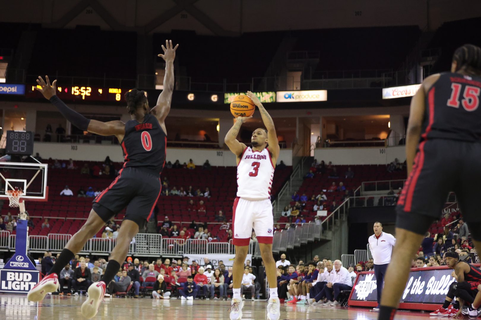 Isaiah Hill, shoots a 3-pointer against a UNLV defender. (Marcos Acosta/The Collegian)