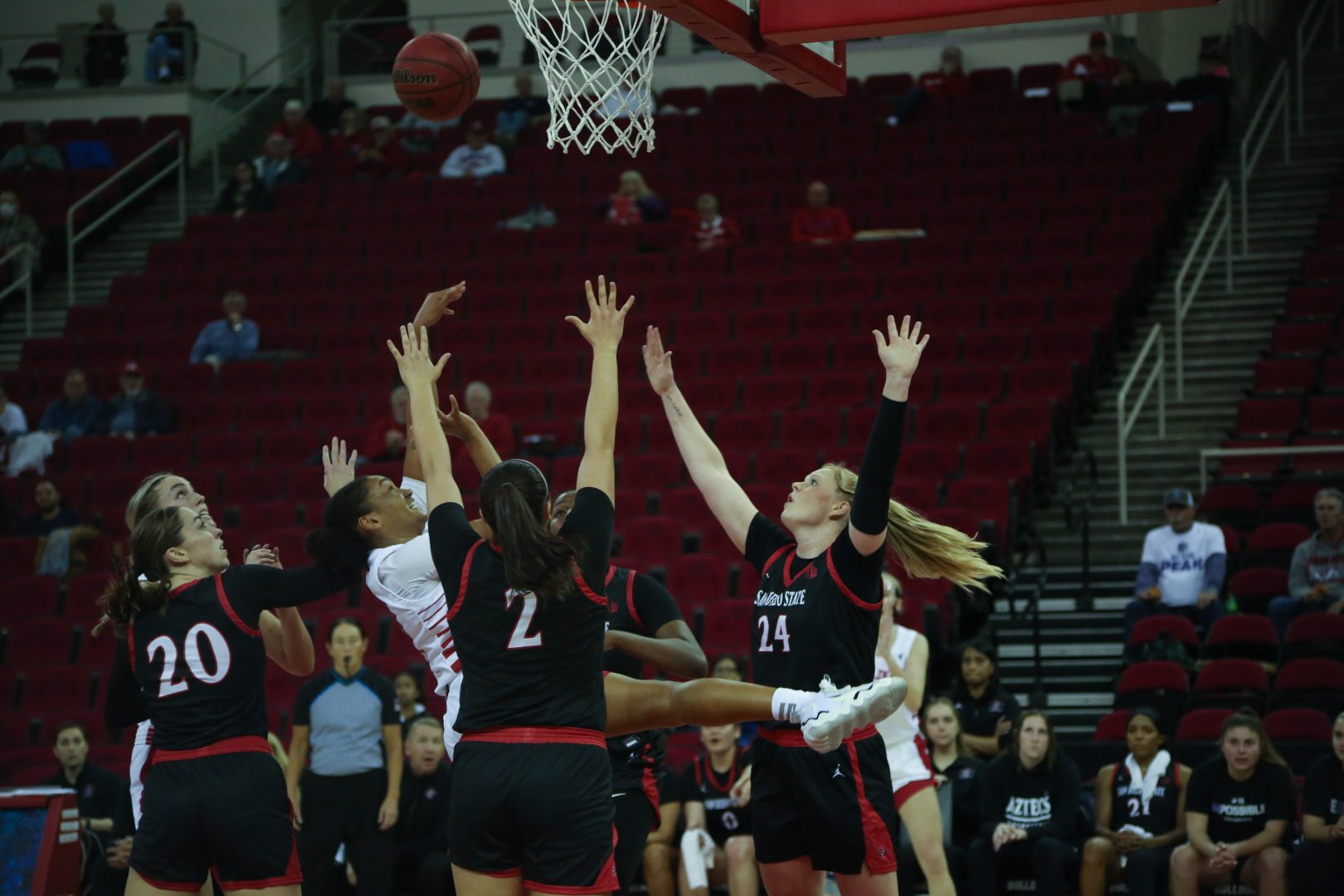 Bulldog Amaya West finishes an and-one layup over three San Diego State Aztec defenders on Jan. 11 at the Save Mart Center. (Manuel Hernandez/The Collegian)