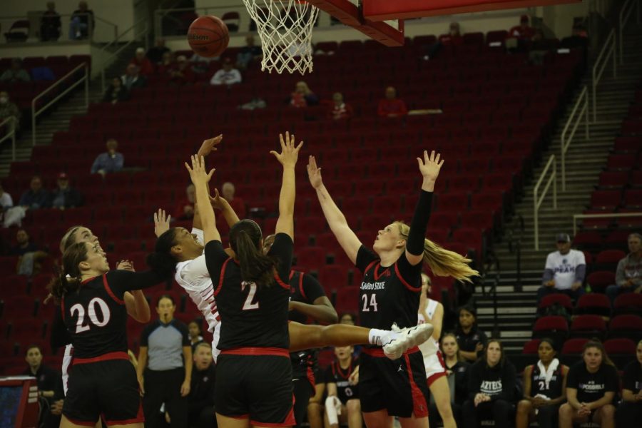 Fresno States Amaya West shoots over UNLV defender in the second quarter. She led the ‘Dogs in scoring with 11 points on Jan. 5, 2023, at the Save Mart Center. (Manuel Hernandez/The Collegian)