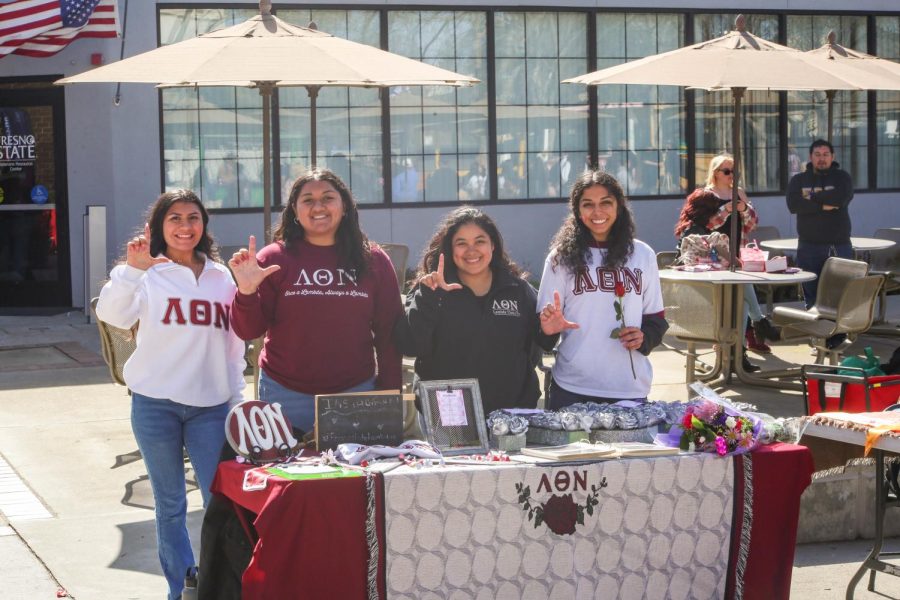 Lambda Theta Nu Sorority tables to enroll more students to join during Club Rush. 