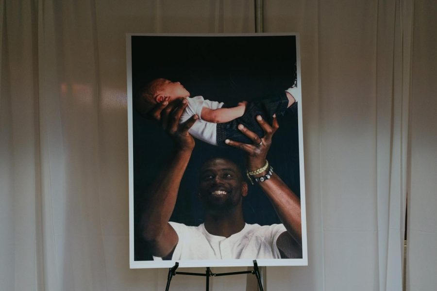 A photograph of Tyre Nichols holding his child sits in the foyer of Mississippi Boulevard Christian Church on Wednesday, Feb. 1, 2023, in Memphis, Tennessee.