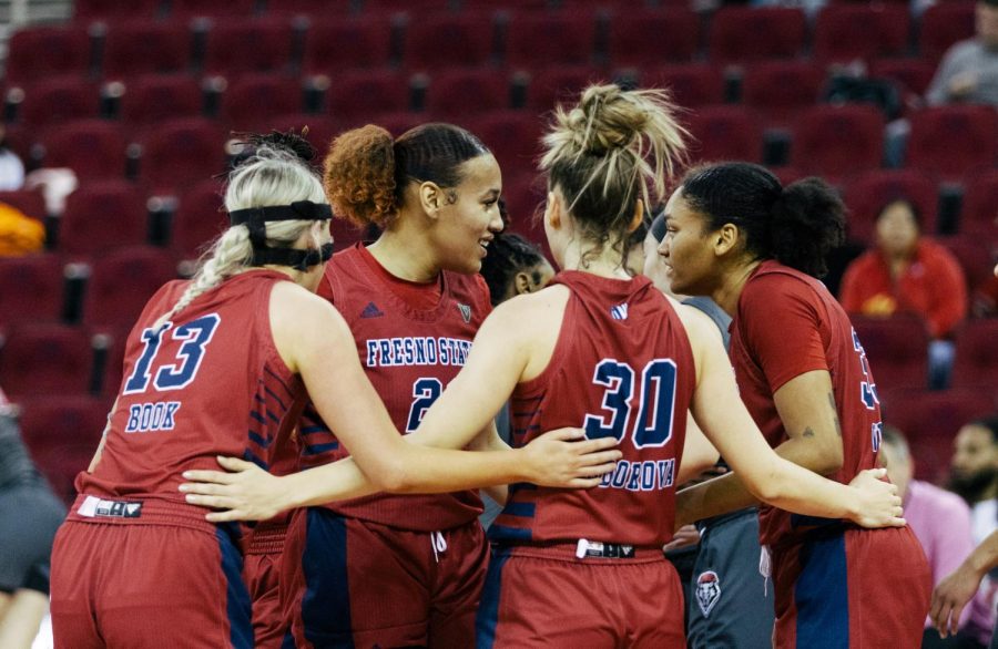 Fresno State seniors in a huddle on Feb. 28 at the Save Mart Center. 