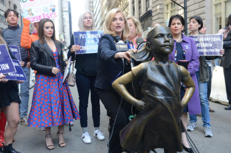 U.S. Rep. Carolyn Maloney, D- N.Y., center, is joined by activist/actress Alyssa
Milano, left, and other members of an ERA coalition calling for ratification of
the Equal Rights Amendment to the Constitution in a press conference held
on Monday, June 4, 2018, by the Fearless Girl statue in Lower Manhattan, New
York. (Susan Watts/New York Daily News/TNS)
