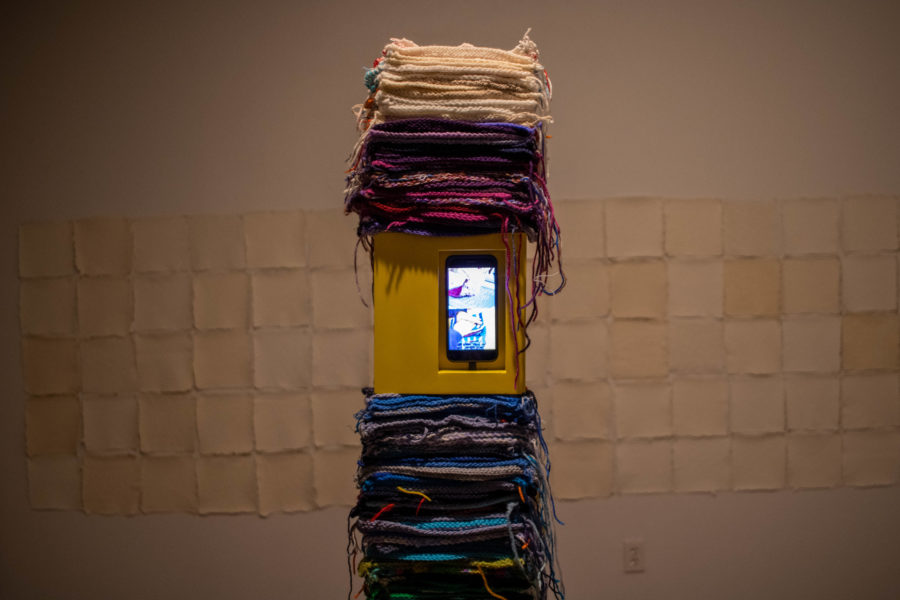 A Patch Went on A Journey is the title piece for the show. It utilizes a phone that displays the deconstruction of the blanket made by Bouwmans mother. (Sarah Delgado/The Collegian)