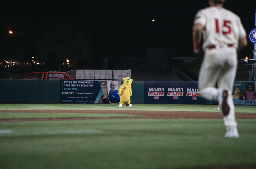 Parker streaks across the outfield before being tackled by security after a half-inning.