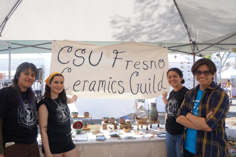 Sophia Chapa (pictured third from left), president of the Ceramics Guild and other members sold to attendees at Vintage Days. (Cesar Maya/The Collegian)