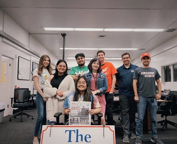 The editorial board and some reporters of the spring 2022 staff pose after their last production night of the semester. (The Collegian Archives)