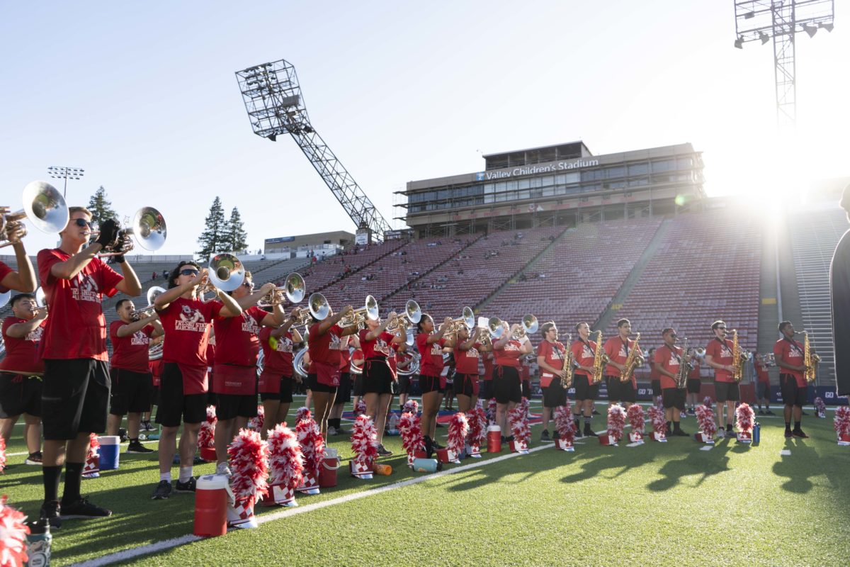 The Bulldog Marching Band warms up at the start of the 2022 public rehearsal at Valley Childrens Stadium. 