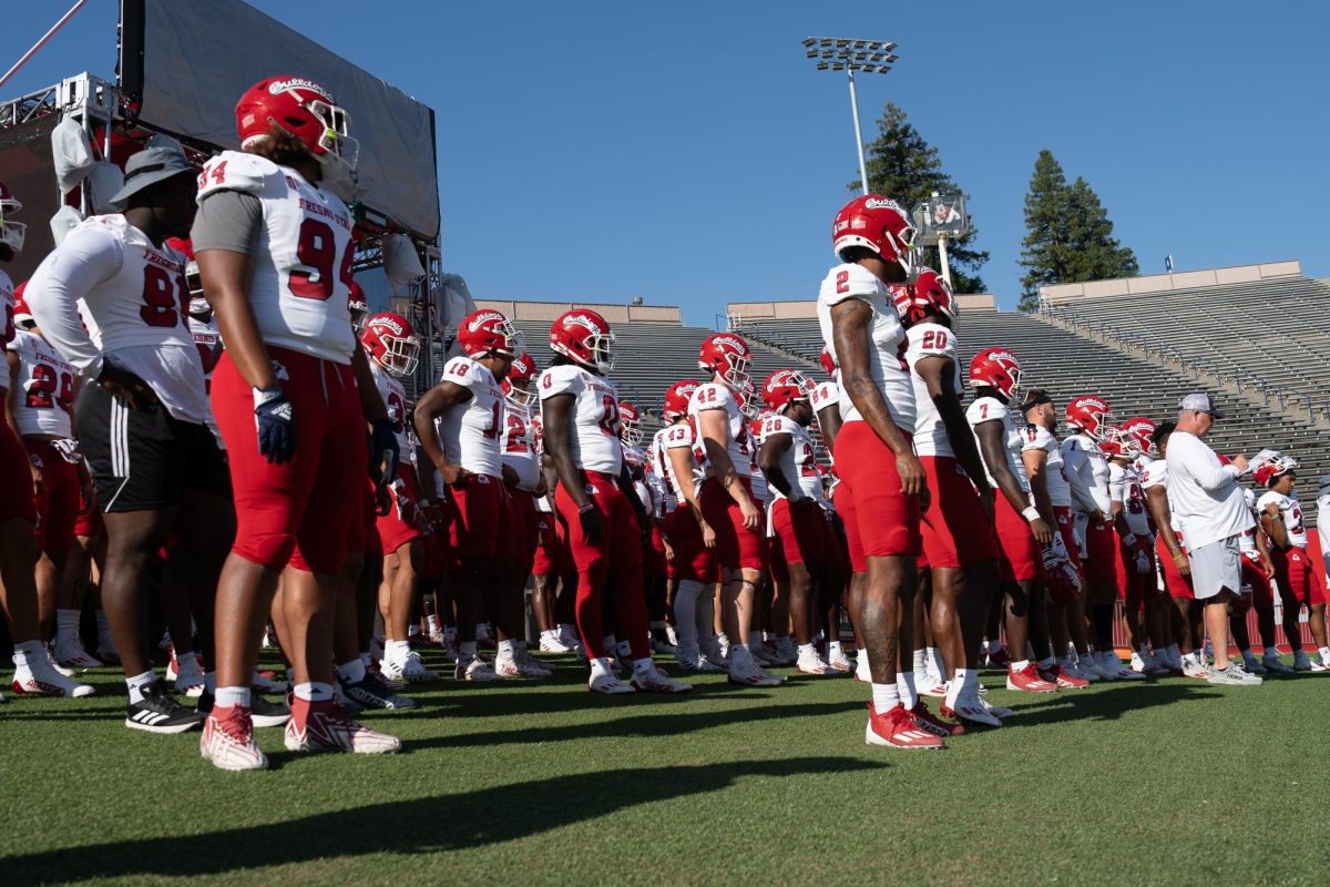 The Fresno State football team heads down the ramp at Valley Childrens Stadium before one of its fall camp scrimmages. 