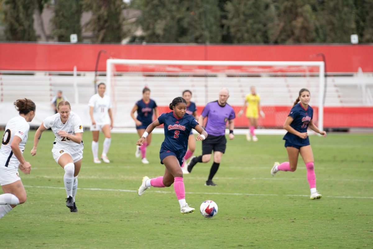 Junior Haley Espinoza #2 dribbles the ball down the field against Colorado College at the Bulldog Soccer Stadium on Oct. 22. 