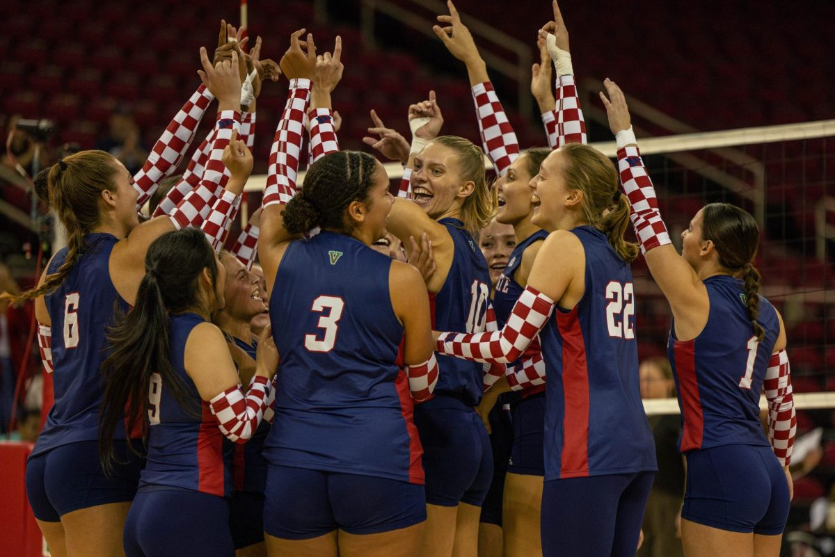 The Fresno State volleyball team celebrates after a win against Wyoming on Oct. 21 at the Save Mart Center. 