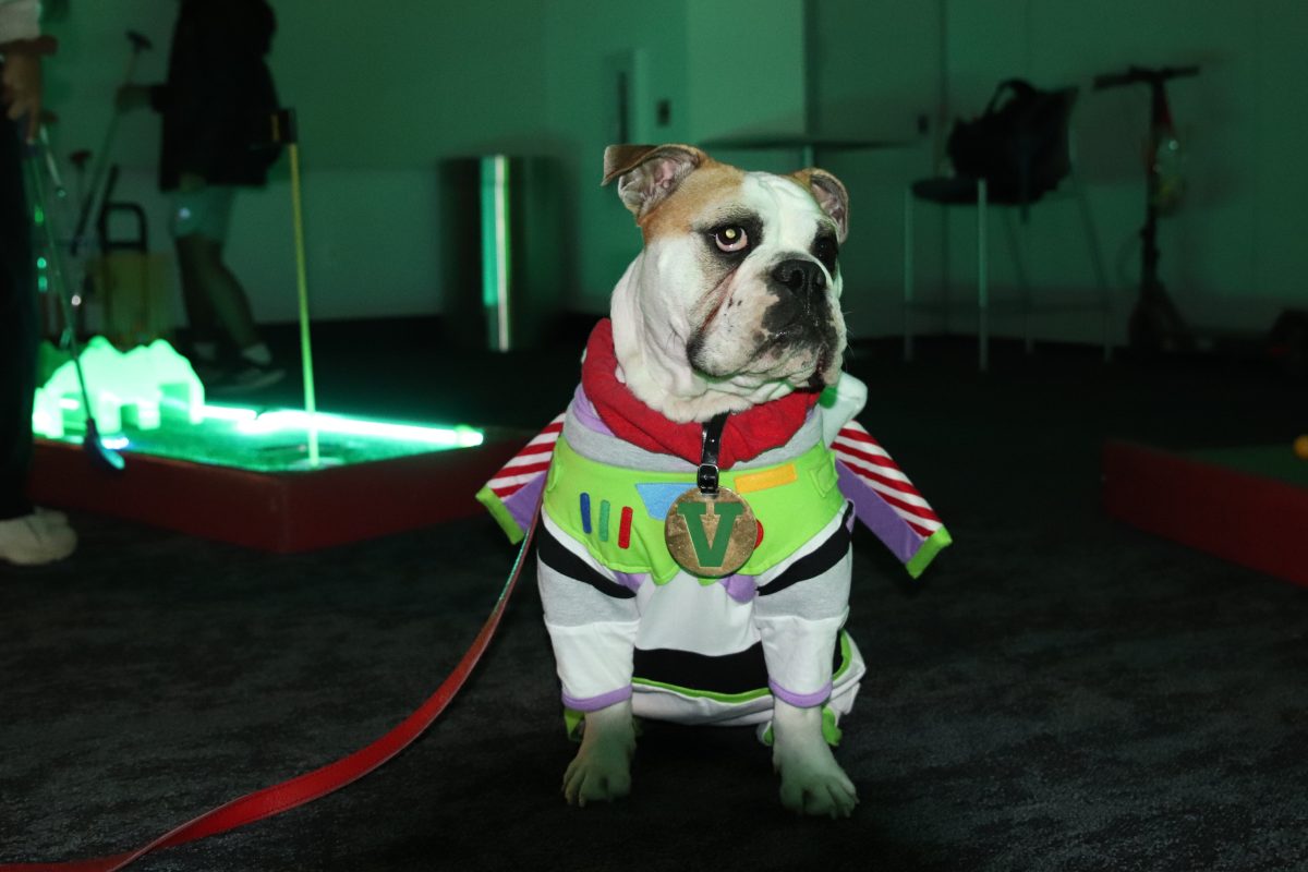 Victor E. Bulldog IV shows up as Buzz Lightyear from Toy Story to meet students and pose for photos. (Jayronan Vanthy/The Collegian)