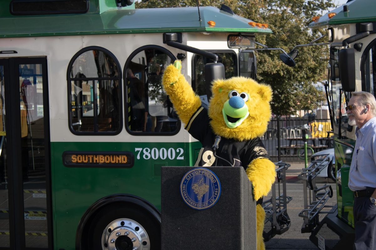 Parker T. Bear show off the new Hop Trolley at its debut on Nov. 2 in Downtown Fresno