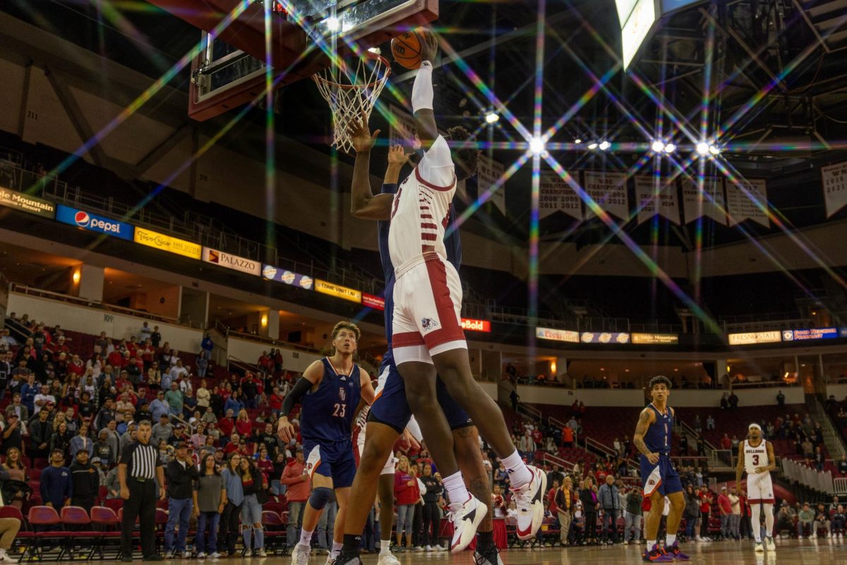 Bulldog center Enoch Boakye reaches for a dunk against Fresno Pacific at the Save Mart Center on Nov. 6. 