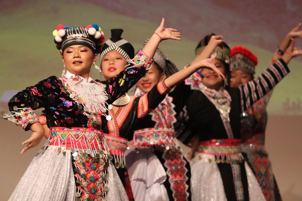 The celebration includes a presentation of traditional Hmong clothing.