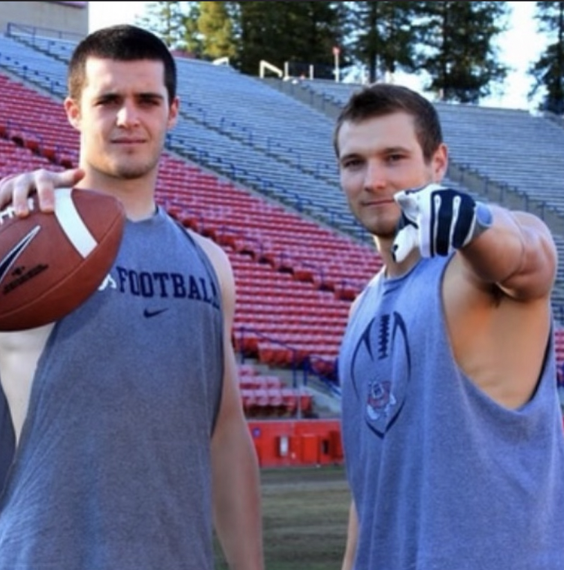 Devon Wylie and Derek Carr pose for a picture. 