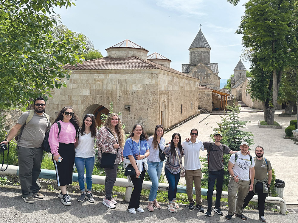 Left to right: Charles Garabedian, Careen Derkalousdian, Carina Tokatian, Julia Eritzian, Christine Pambukyan, Christa Eritzian, Ariana Garabedian, Dustin Vartanian, Michael Mazman, Jonathan Chardukian, and Caleb Arizmendez in front of the Monastery of Haghartsin.