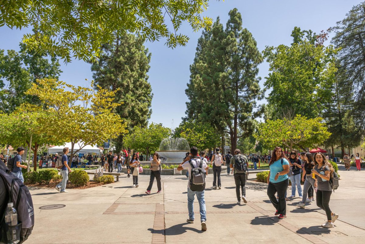 Students+walking+by+the+Fresno+State+Memorial+Fountain+on+Sept.+3%2C+2023.+