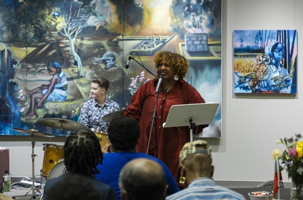Poet Faylita Hicks performing at the Black Arts Lounge on Thursday, Feb. 22, 2024 in the Leon S. Peters Ellipse Gallery. (Carlos Rene Castro/ The Collegian)