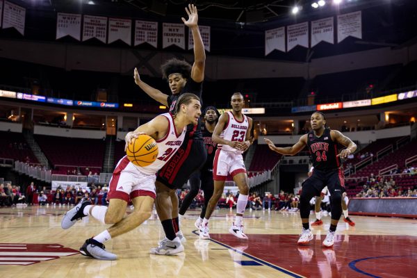 Bulldog guard, Isaiah Pope breaks through UNLV player at the Save Mart Center on Feb. 14.