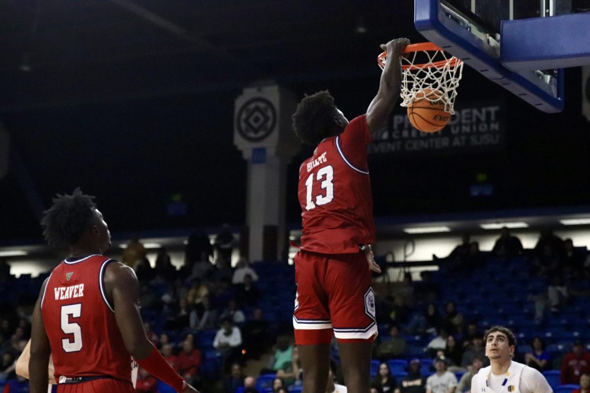 Bulldog Center, Enoch Boakye dunks the ball in the Provident Credit Union Event Center on Feb. 6.