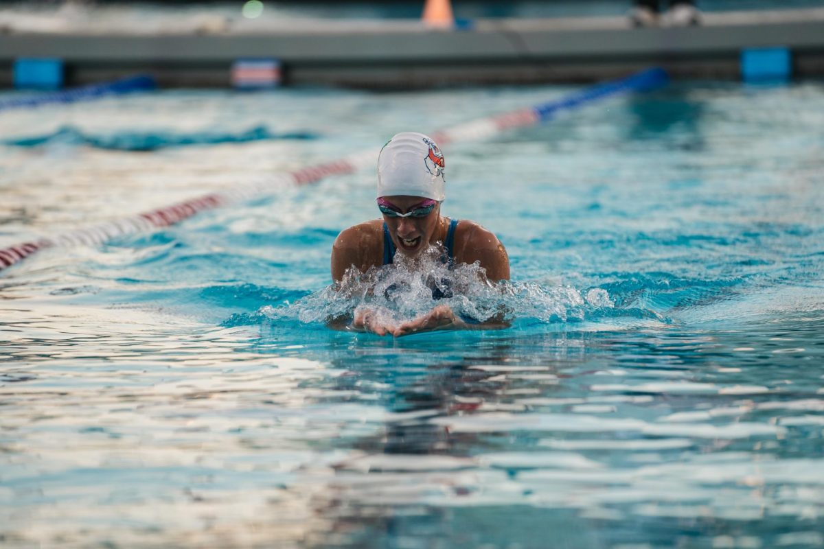Bulldog Aliz Kalmar swims in race at the Aquatics Center. 