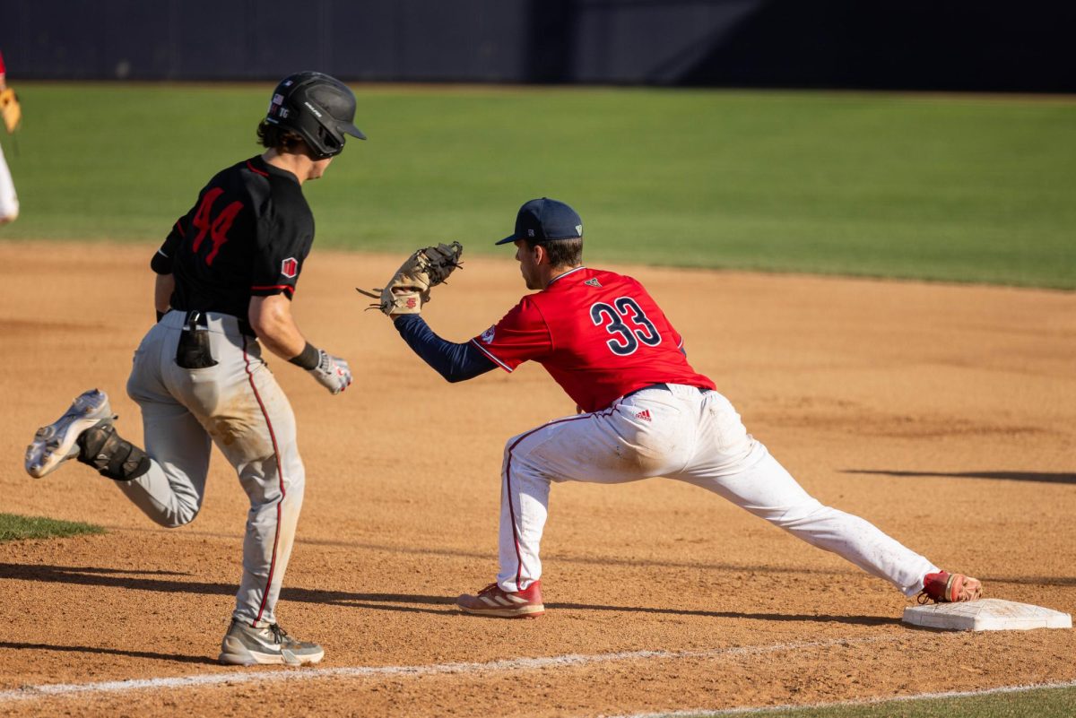 Bulldog utility player Tommy Hopfe gets Aztecs player out on March 3 at the Pete Beiden Field at Bob Bennett Stadium.  
