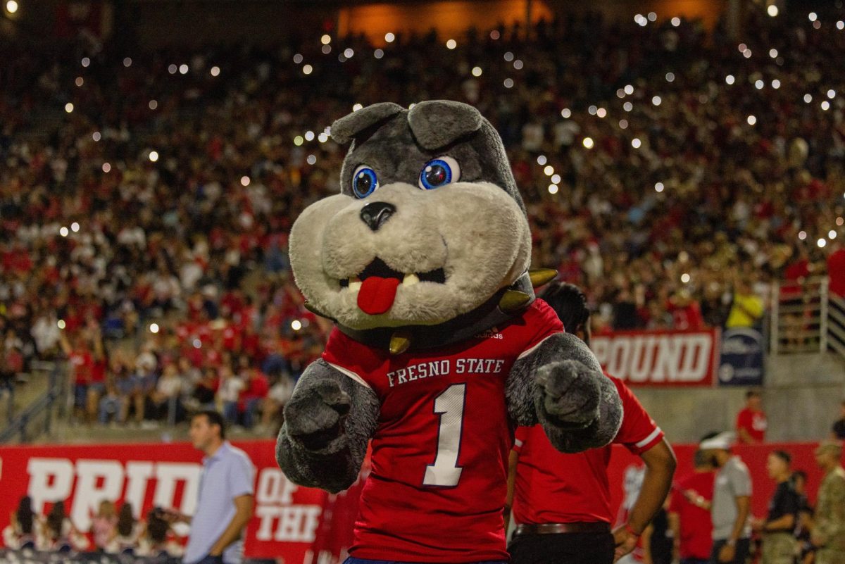 Fresno+State+mascot+TimeOut+cheers+during+a+football+game+at+Valley+Childrens+Stadium.