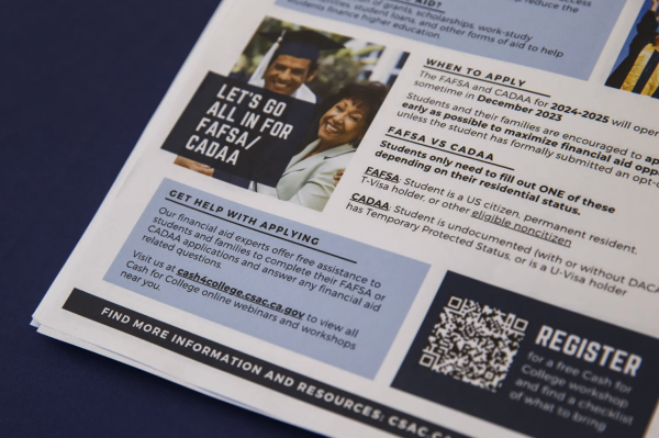 FAFSA fact sheets are displayed at College Information Day at UC Berkeley in Berkeley on Oct. 14, 2023. Photo by Juliana Yamada for CalMatters