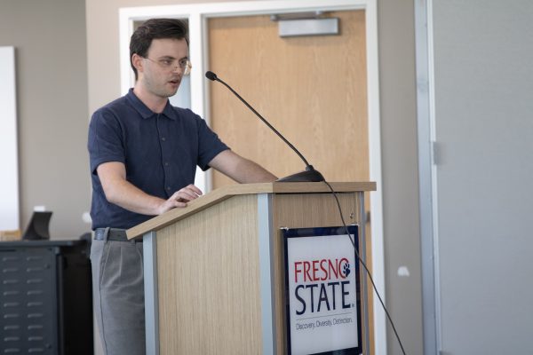 Frederick Lisitsa, executive vice president of Associated Students Inc., recuses himself from his position to present a ceasefire resolution to the student senate on April 10.