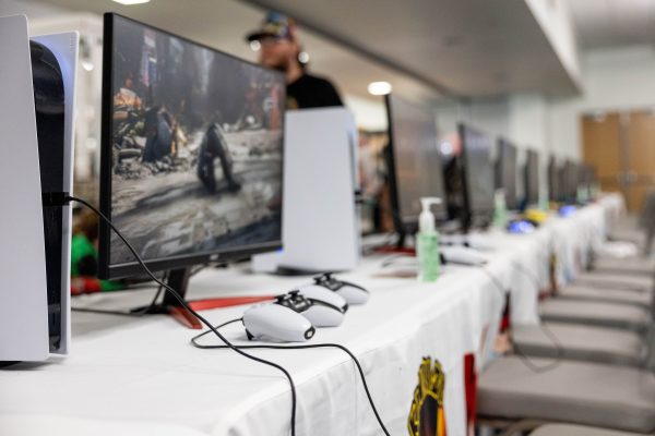 Game consoles lined up at Anime Gaming Con as part of a Vintage Days activity. Each monitor had two controllers to play with multiple people in games like Mario Kart and Super Smash Bros.