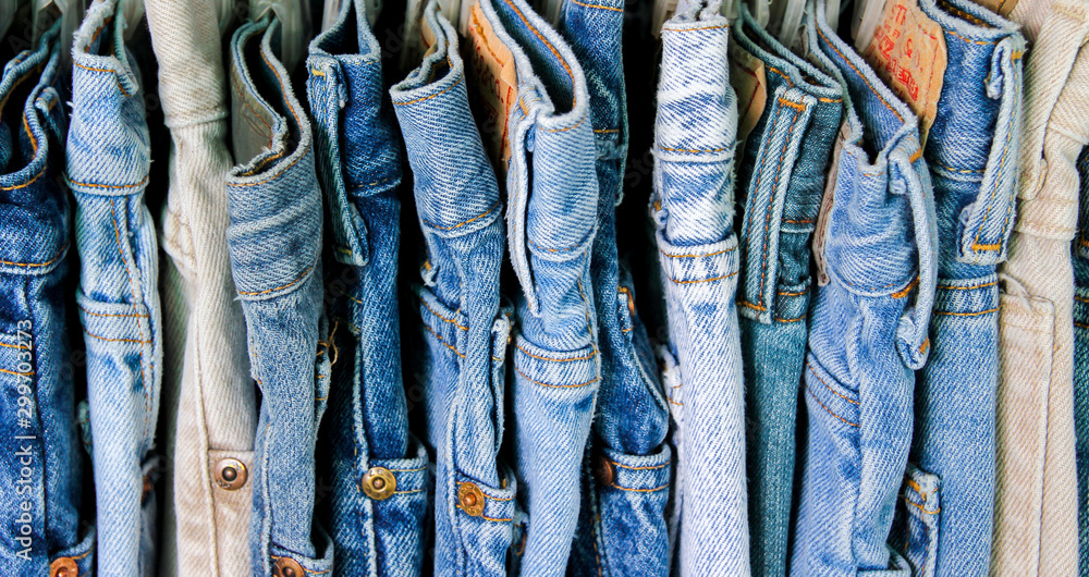 A+rack+of+second+hand+jeans.
