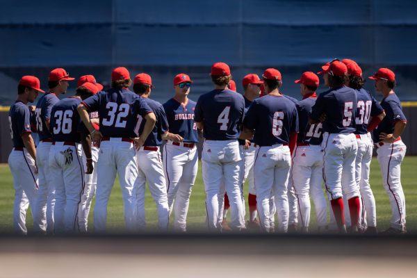 The Fresno State baseball team huddles ahead of its game against San Jose State on April 20 at Pete Bieden Field. 