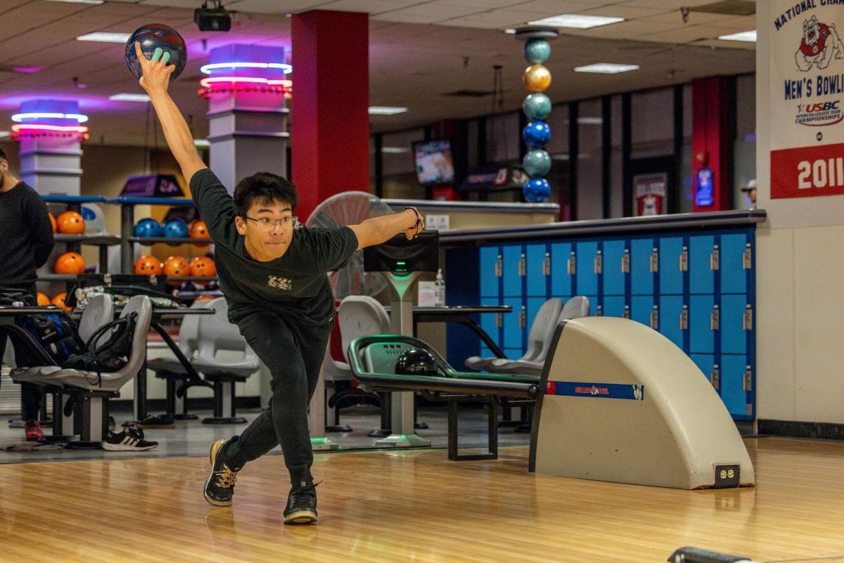 Fresno State bowling club member Vincent Luong throws bowling ball at the University Student Union on Feb. 21. 