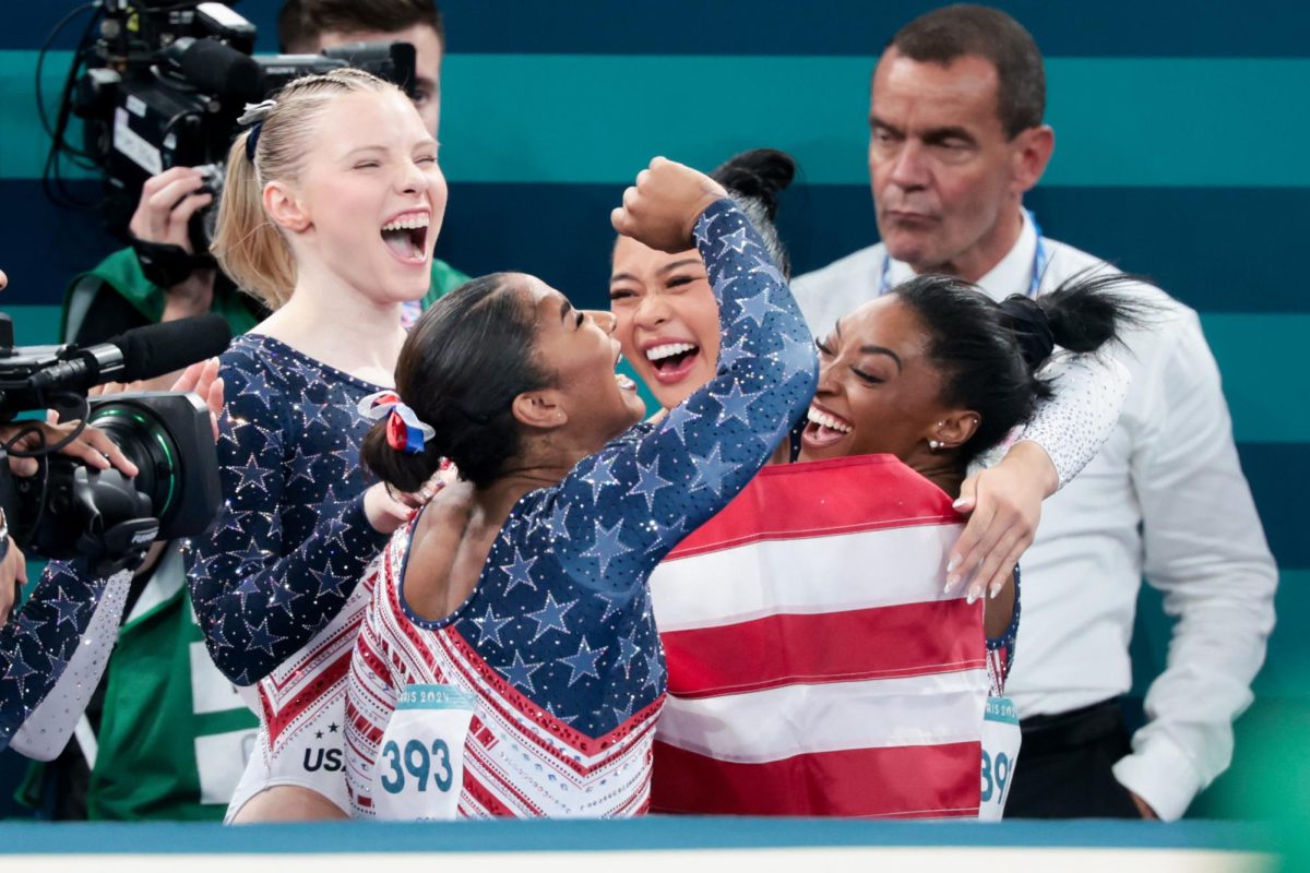 Team USA's Jade Carey, from left, Jordan Chiles, Suni Lee, and Simone Biles celebrate during the women's gymnastics team final at Bercy Arena on Tuesday, July 30, 2024 in Paris.