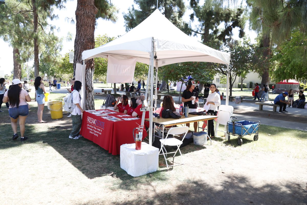 Jan and Bud Richter Center for Community  Engagement and Service- learning tabling at the Community Service Opportunities Fair on Aug. 28 in the Memorial Gardens. 