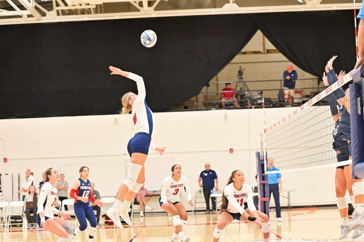 Outside hitter Ella Rud going for the ball in annual exhibition game against California Baptist University. 