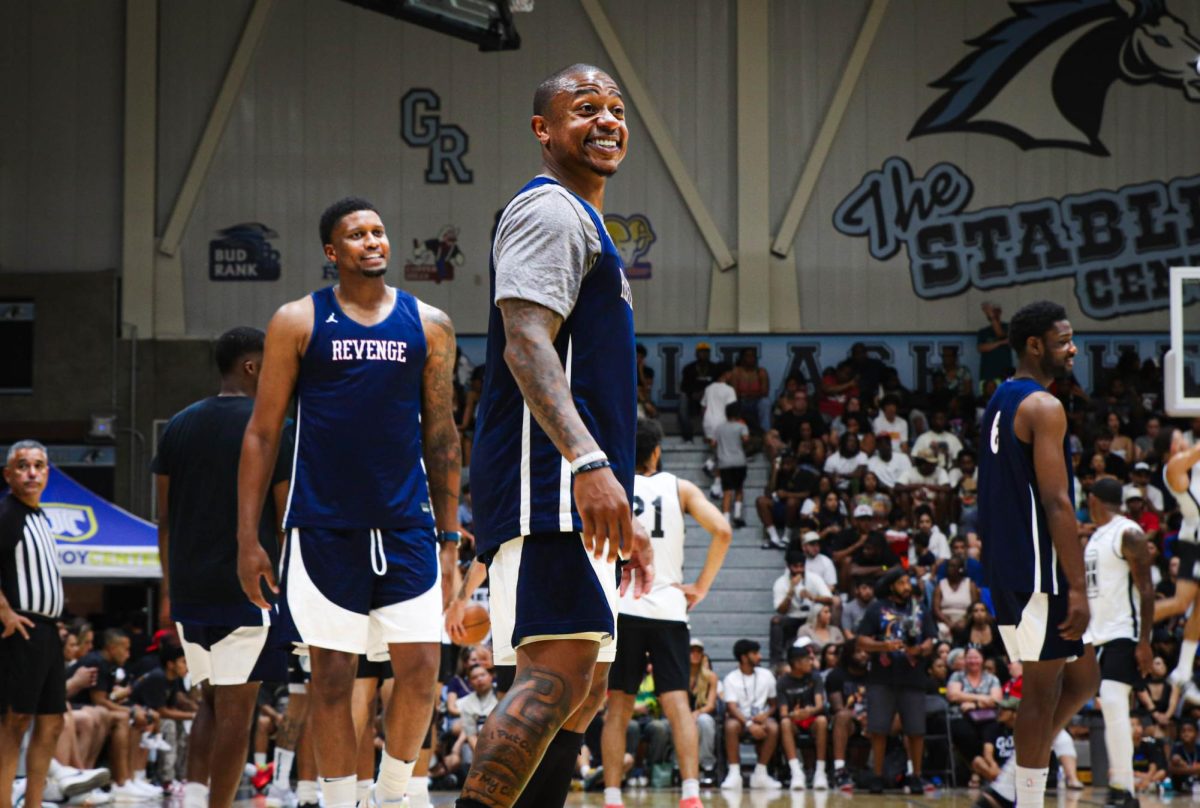 Isaiah Thomas smiles down the court during warm ups. 