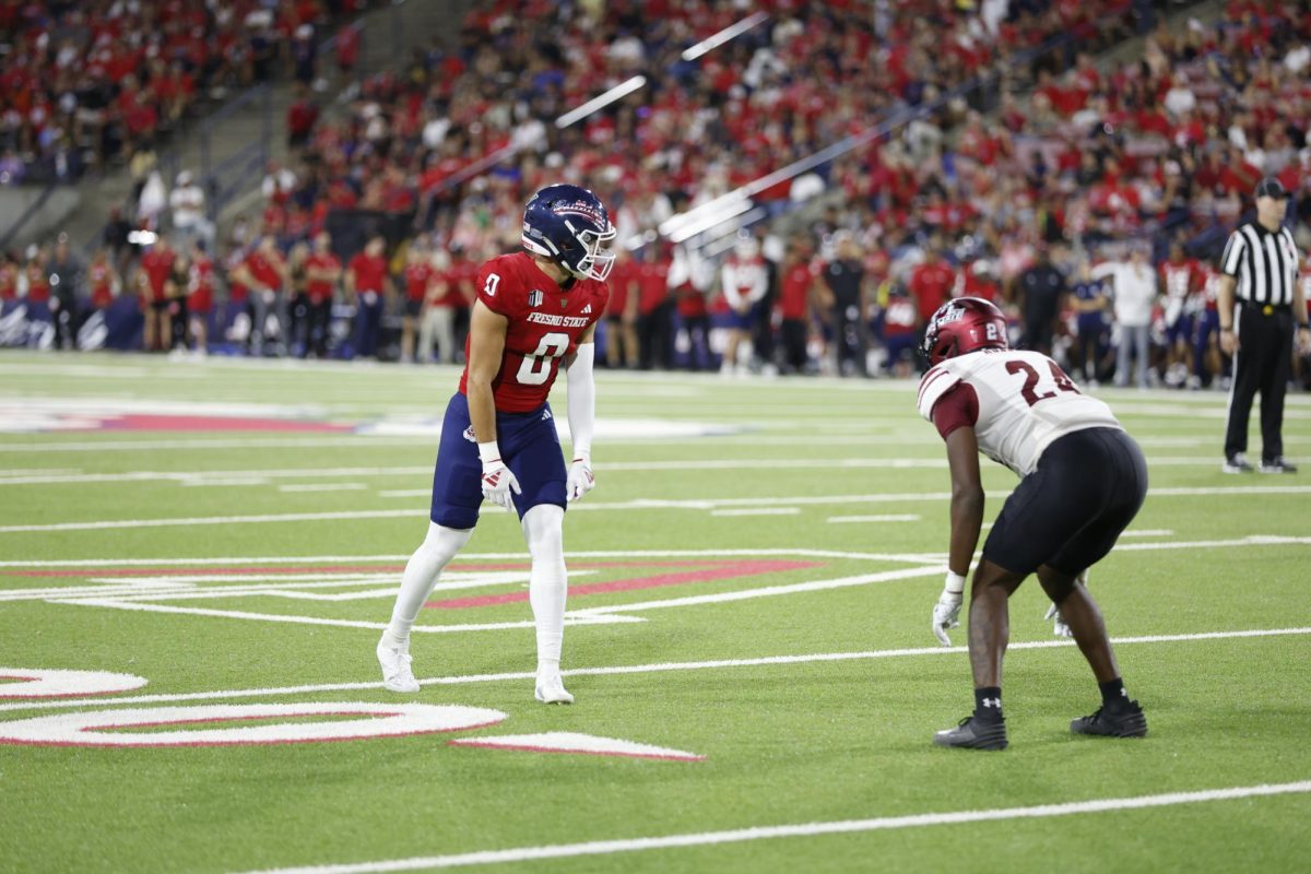 Wide receiver Mac Dalena looks down the field during a play at Valley Children Stadium, on Sept. 14. 