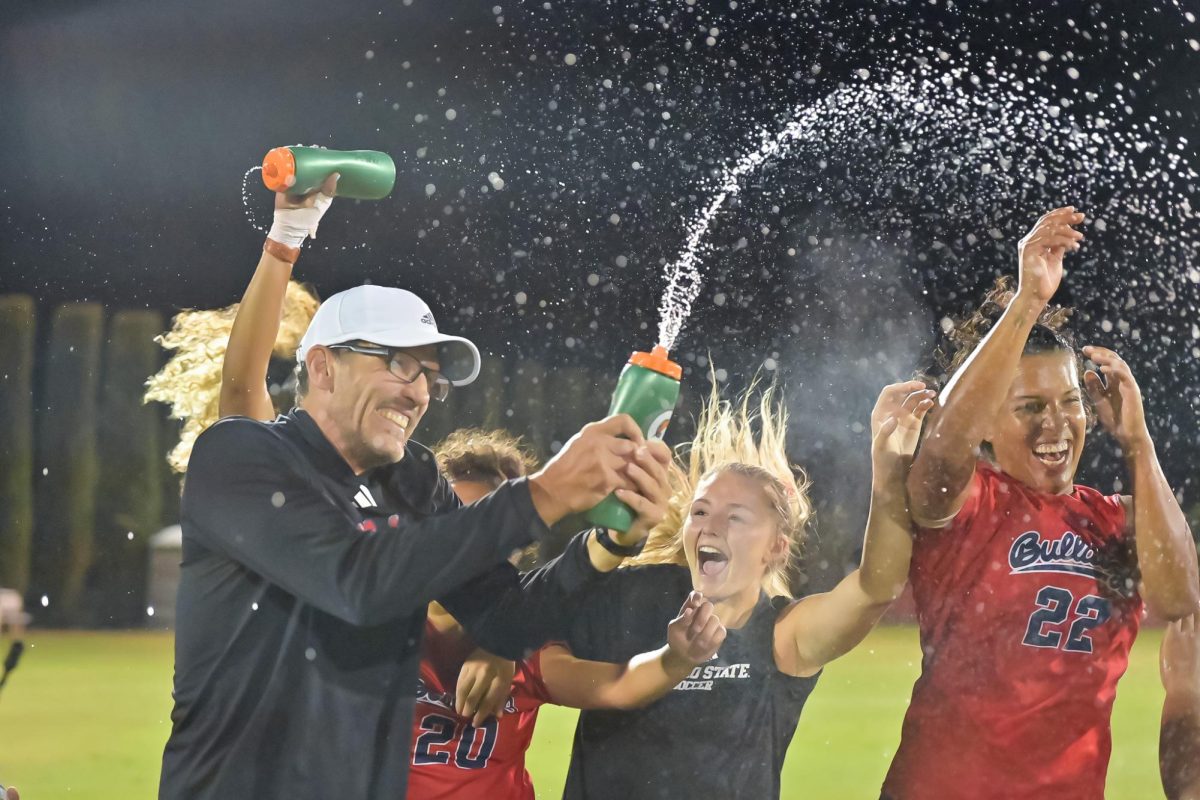 Head Coach Brian Zwaschka celebrates with his team after their come-from-behind victory. 