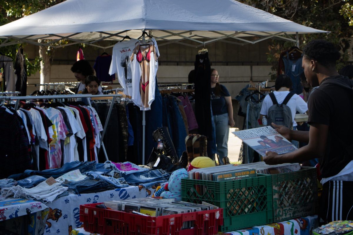 Fresno State students browse stock at Memorial Gardens during the Spotlight Market on Sept. 27. 