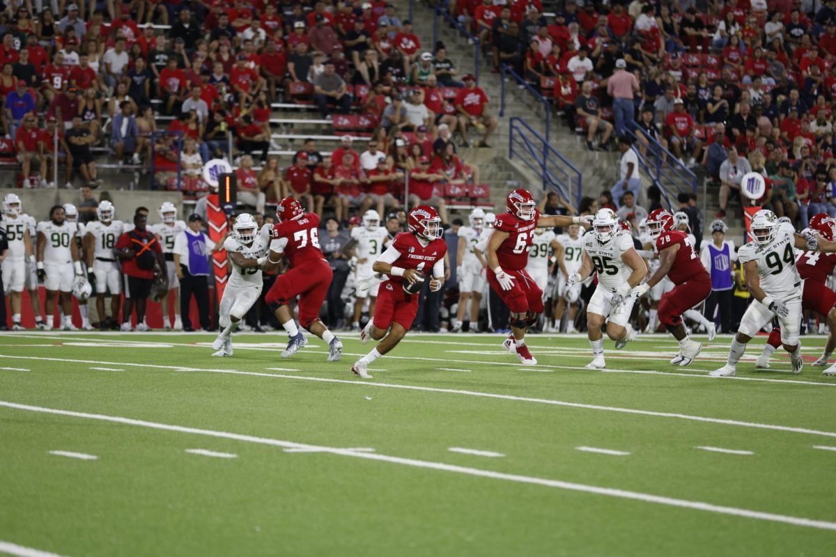 Mikey Keene maneuvers the pocket looking for a receiver downfield. 