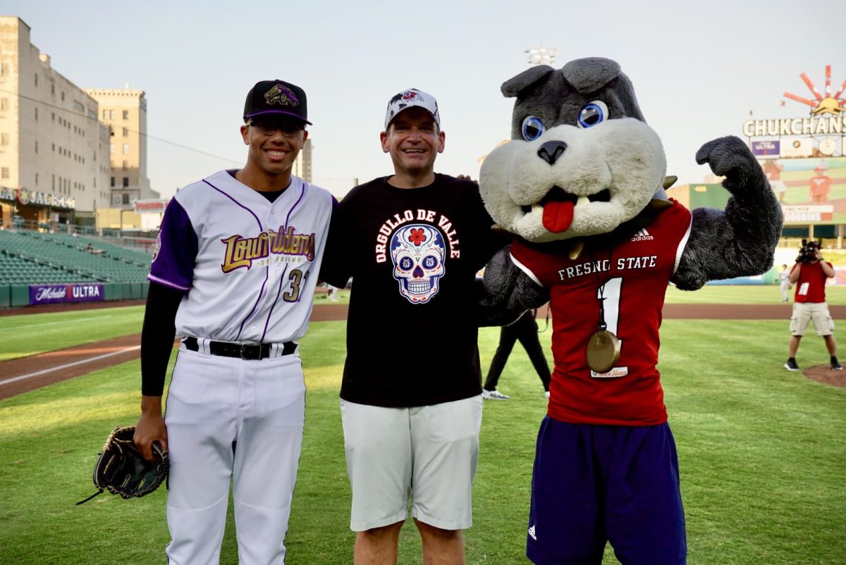 Athletic Director Garrett Klassy posing for a picture with Grizzlies pitcher Yanzel Correa and Timeout after throwing the ceremonial first pitch.