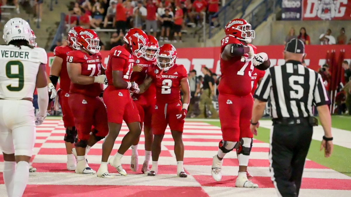 Malik Sherrod and his teammates celebrate after rushing for a touchdown in the Bulldogs win. 